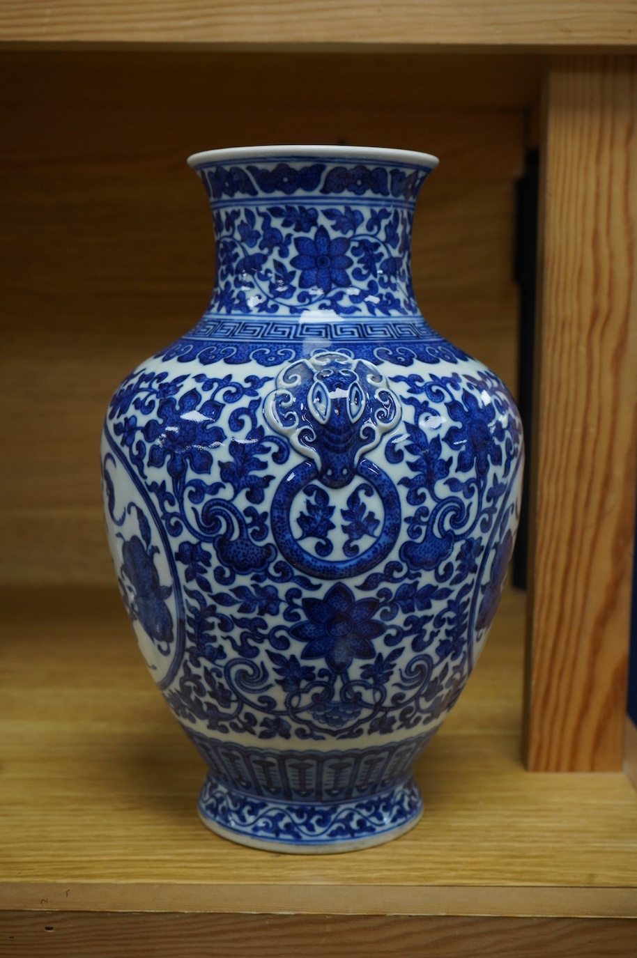 A Chinese blue and white 'peaches' vase, Qianlong mark but later, 27cm high. Condition - good